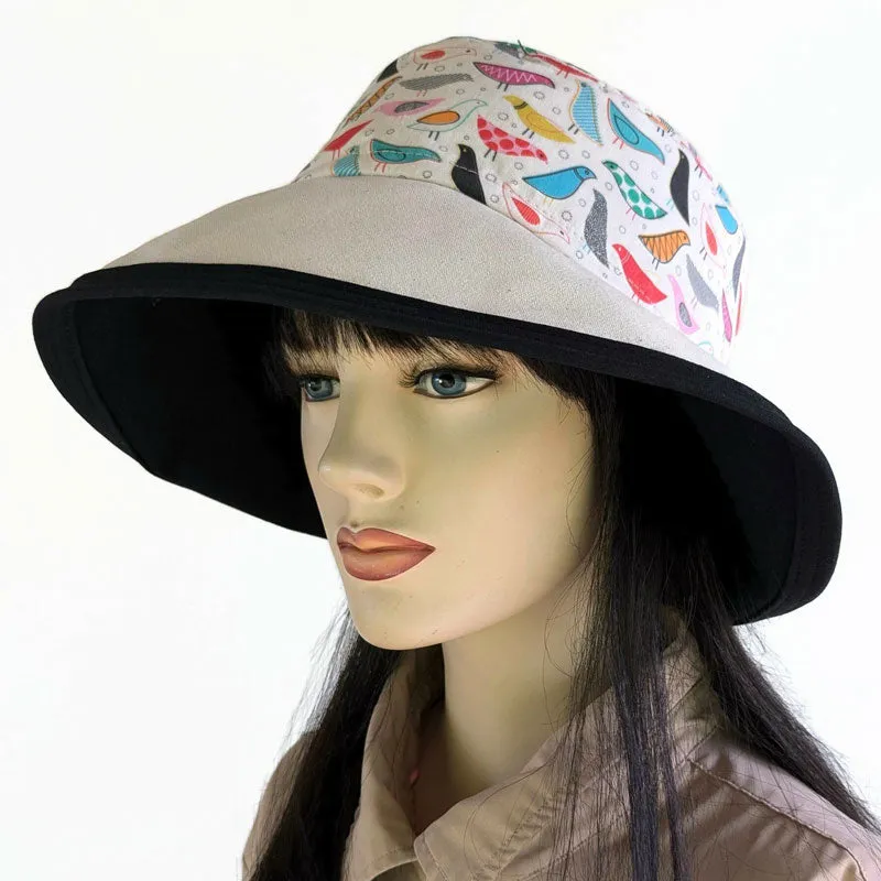 103-b UV Sunblocker with wide brim featuring artsy birds