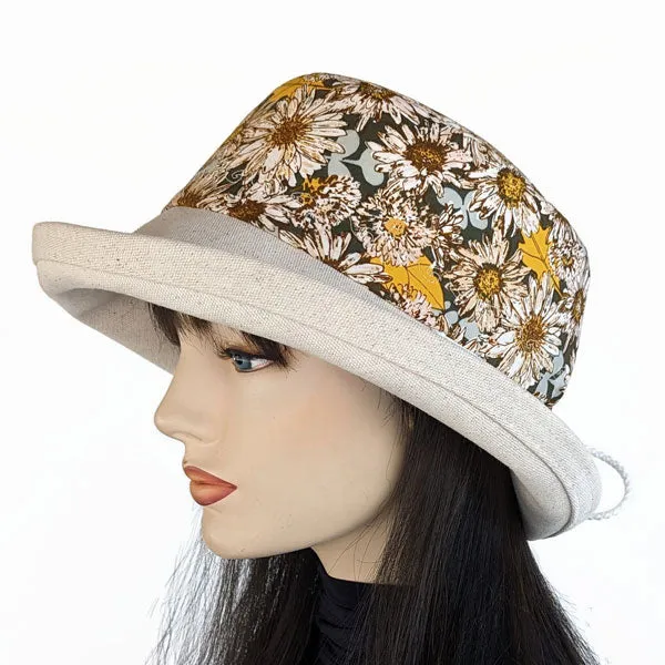 115-a Sunblocker UV summer hat with large wide brim featuring sunflowers print in earth tones