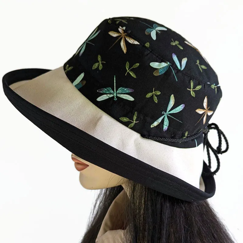 Sunblocker with lovely dragonfly print with black base, adjustable fit, wide brim